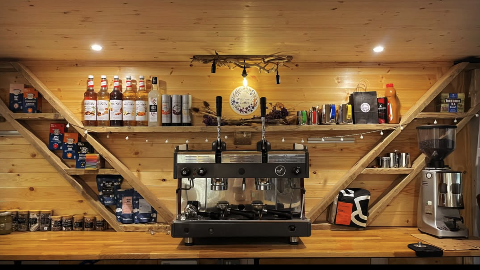 Inside the van: the espresso machine and shelves of syrups